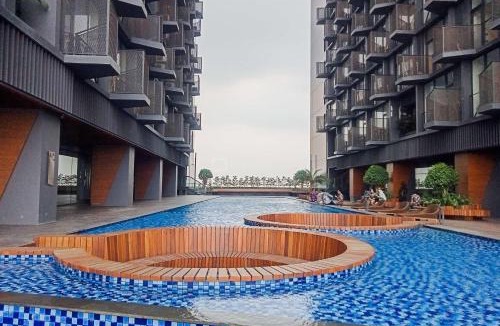 Pagedangan Apartment | Best Deal and Homey 1BR Apartment Carstensz Residence By Travelio