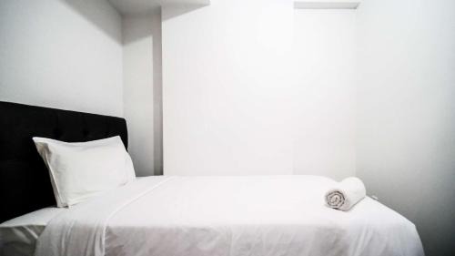 Sidoarjo Apartment | Homey 2BR Apartment at Suncity Residence By Travelio