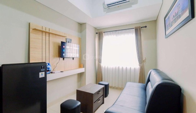 Homey and Minimalist 1BR Royal Sentul Park Apartment By Travelio