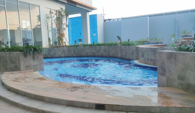 Restful Snug Studio Room At Apartment Suncity Residence in Sidoarjo