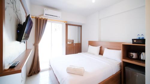 Simple and Comfortable Studio Apartment at Suncity Residence By Travelio in Sidoarjo