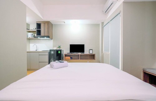 Duren Sawit Apartment | Comfortable Pool View Studio Room at LRT City Jatibening Apartment