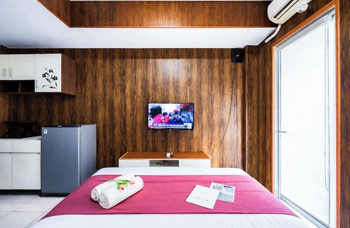 Sidoarjo Apartment | Wood Accents Studio At Tamansari Prospero Sidoarjo Apartment