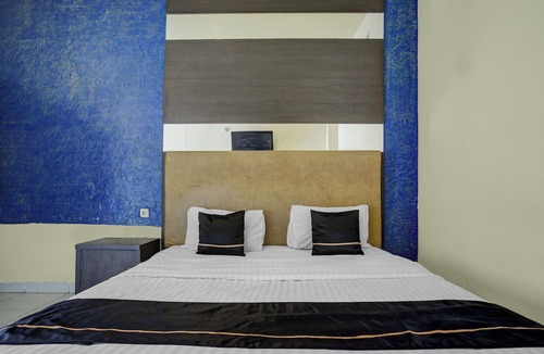 Palembang Hotel | Hotel O near Universitas Widya Dharma