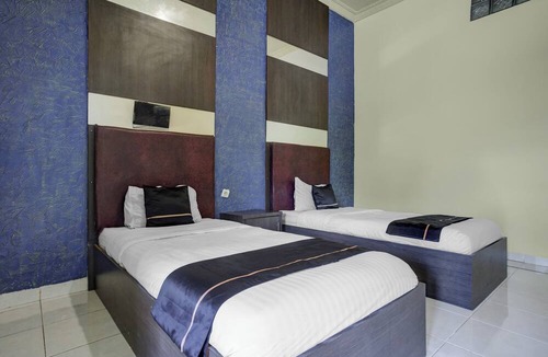 Palembang Hotel | Hotel O near Universitas Widya Dharma