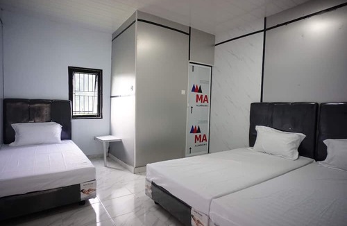Perbaugan Hotel | OYO 94903 Akasia Guesthouse