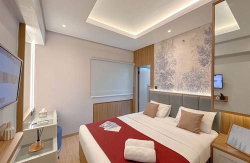 Surabaya Apartment | Modern Look With Wooden Accent 3Br At Kondominium Puncak Marina Apartment