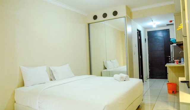 Modern Studio Grand Serpong Apartment By Travelio