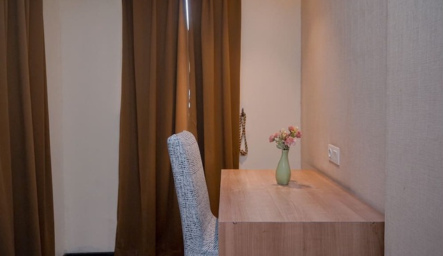 Warm and Minimalist Studio (No Kitchen) at Great Western Apartment
